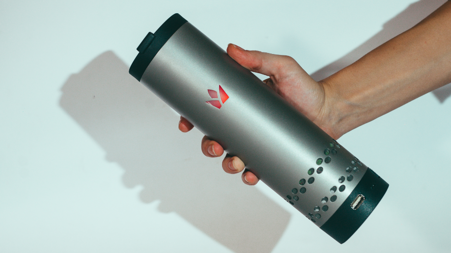 Original silver Yecup 365 smart mug held in one hand